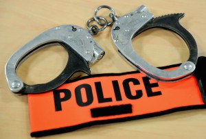 FRANCE-POLICE-HANDCUFFS-BADGE